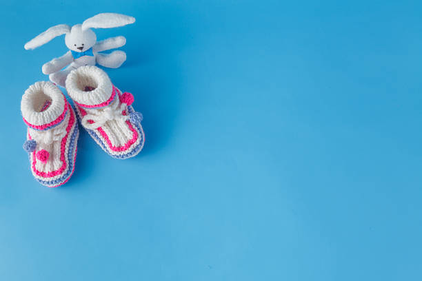 istock Handmade knitted booties  with toy 502323988