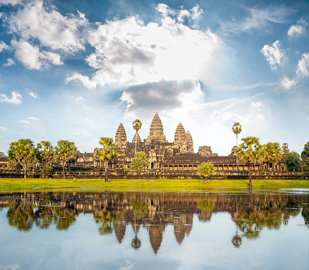 Facade of ancient temple complex Angkor Wat in Siem Reap, Cambodia. Angkor Wat is a popular tourist attraction.