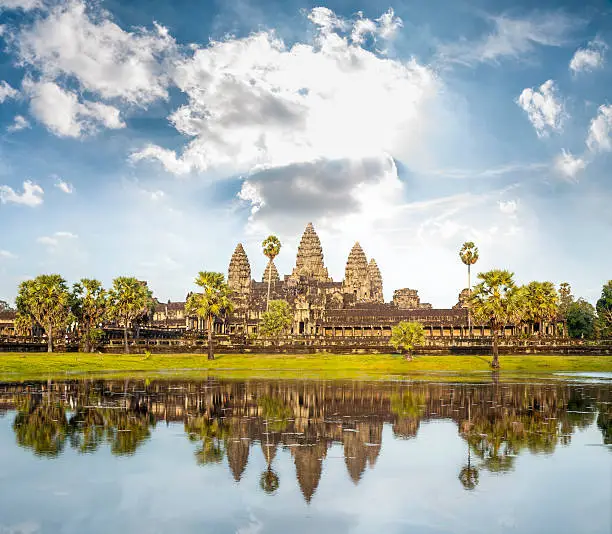 The Temple Of Angkor Wat Reflected In The Lake Near Siem Reap In Cambodia.