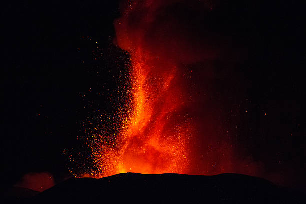 Volcano eruption. Mount Etna erupting from the crater Voragine. stock photo