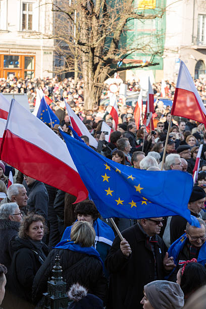 Cracow, Main Square - The demonstration 
Cracow, Poland - December 19, 2015: Cracow, Main Square -  The demonstration of the Committee of the  Protection of the Democracy /KOD/ against the break of law through the government PIS in Poland.  solidarity labor union stock pictures, royalty-free photos & images