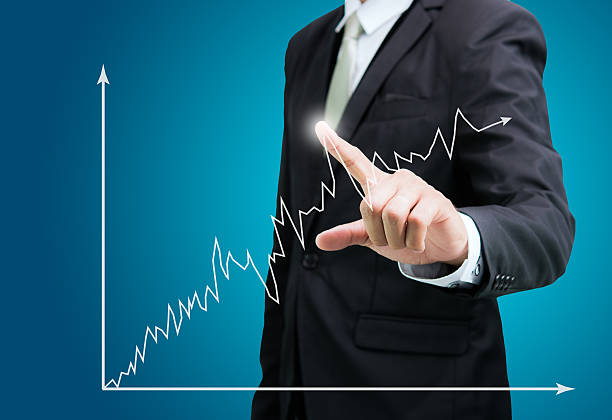 istock Businessman standing posture hand touch graph finance isolated 502348371