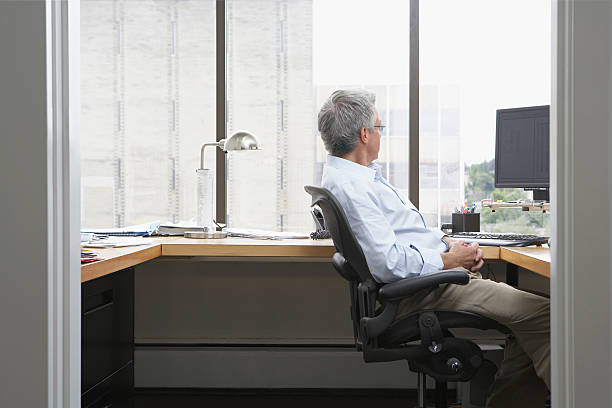 istock Businessman Sitting At Office Desk 502349285
