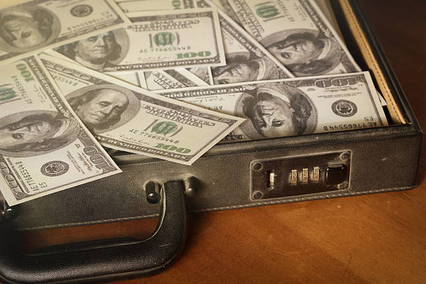 istock Money in briefcase,vintage style color. 502351105