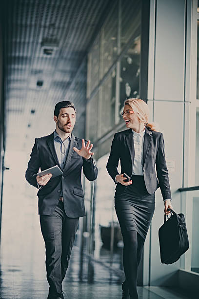 istock Businessmen talking in office hallway 502351754