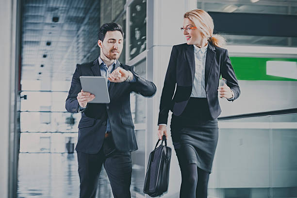 istock Businessmen talking in office hallway 502351792