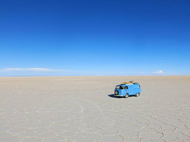 Uyuni, Bolivia - December 19, 2015: A blue VW Bus parked on the biggest salt flat of the world, Salar de Uyuni in Bolivia