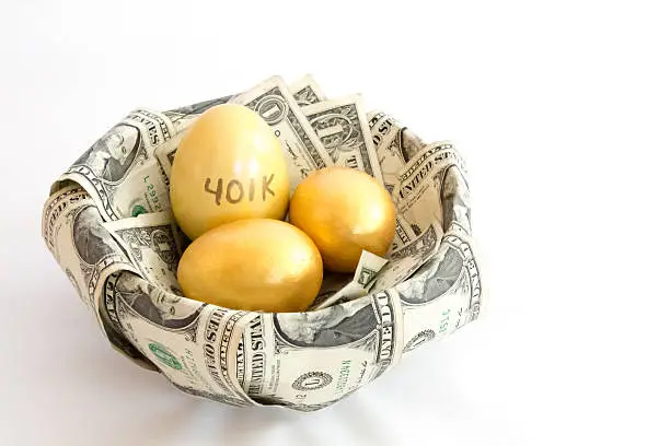 Photo of Golden eggs in a money nest, one labeled 401k