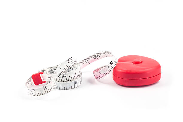 istock Measuring tape in heart shape on white background 502352632