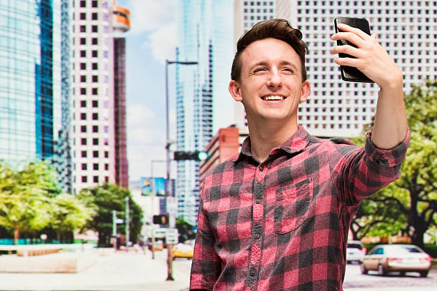 istock Smiling man taking a selfie outdoors 502352718