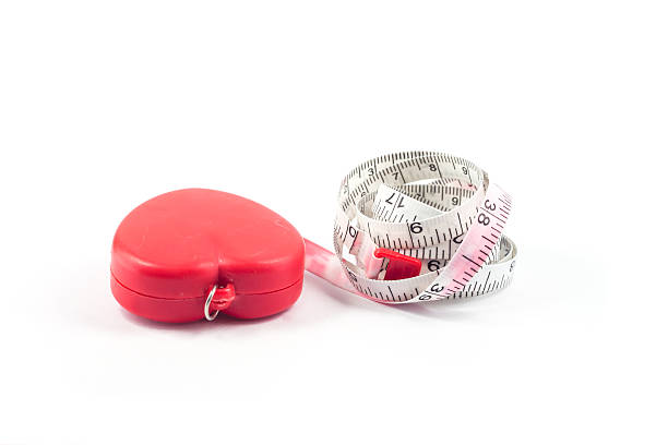 istock Measuring tape in heart shape on white background 502352768