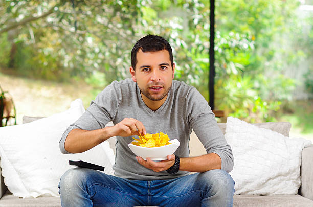 istock Hispanic male wearing light blue sweater plus denim jeans sitting 502355038