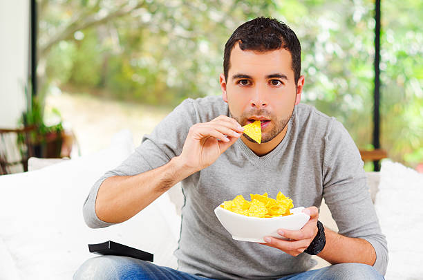 istock Hispanic male wearing light blue sweater plus denim jeans sitting 502355134