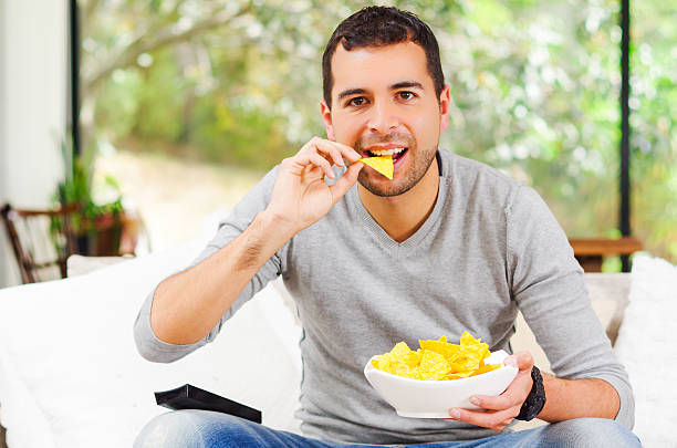 istock Hispanic male wearing light blue sweater plus denim jeans sitting 502355176
