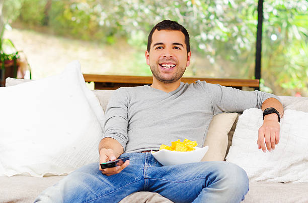 istock Hispanic male wearing light blue sweater plus denim jeans sitting 502355202