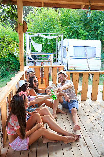 istock Friends sitting on pavilion in front of caravan 502357820