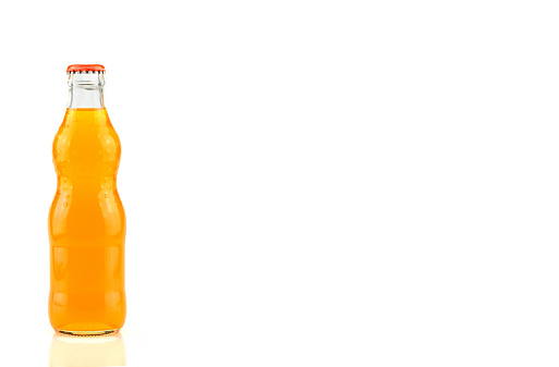 bottle of  Orange Fanta (coca cola) glass soda isolated on a white background