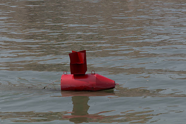istock Red buoy in a river 502358468