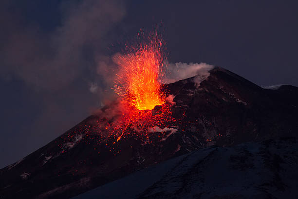 Volcano eruption. Mount Etna erupting from the crater Voragine. stock photo