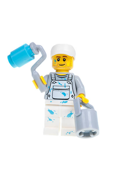 Pila, Italy - April 4, 2011: An old Lego character from the 80s on a green Lego surface. LEGO are famous construction toys manufactured by the Lego Group, a company based in Billund, Denmark.