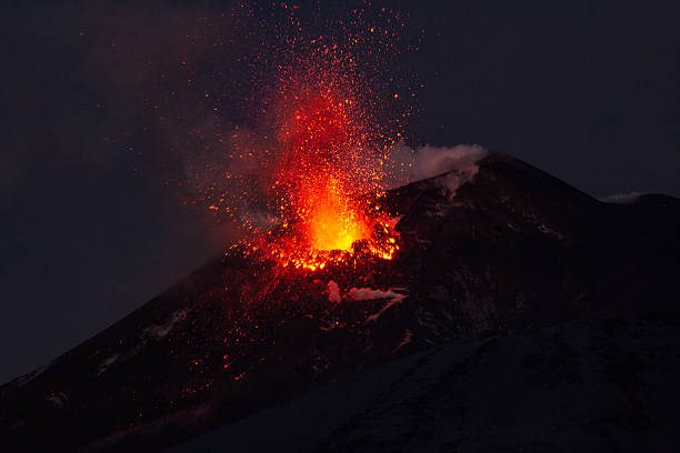 istock Volcano eruption. Mount Etna erupting from the crater Voragine. 502359020