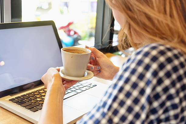istock asia beautiful using her laptop and drinking coffee in cafe 502359922