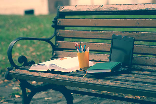 istock books on a bench in the school year 502360670