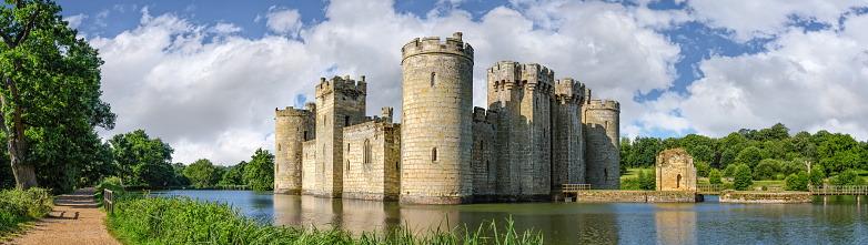 Sussex, United Kingdom - July 9, 2013: Moated castle Bodiam near Robertsbridge in East Sussex, England  was built in 1385 to defend the area against French invasion during the Hundred Years' War.