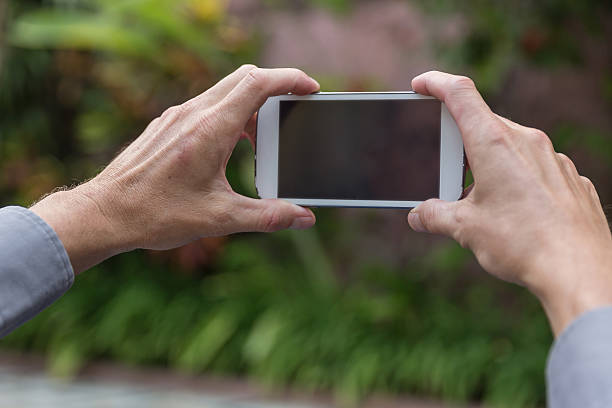 istock Male hands taking pictures 502360916