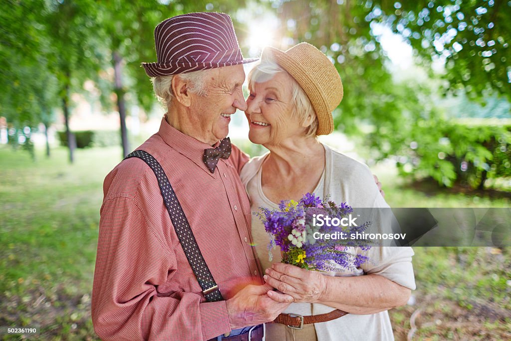 Lovely couple Happy elderly couple in love enjoying summer day together Love - Emotion Stock Photo