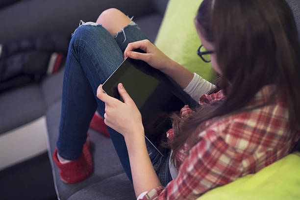 istock Teenage girl using digital tablet 502362444