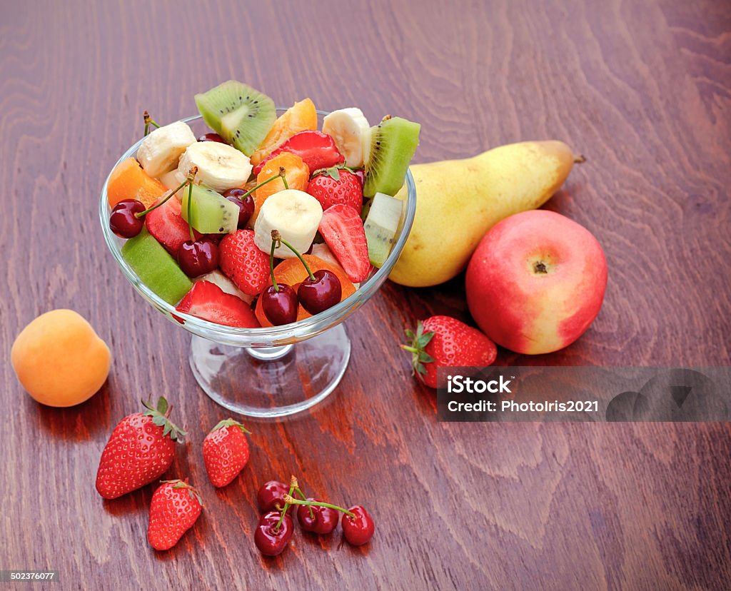 Fruit salad Fruit salad in glss bowl on table Agriculture Stock Photo