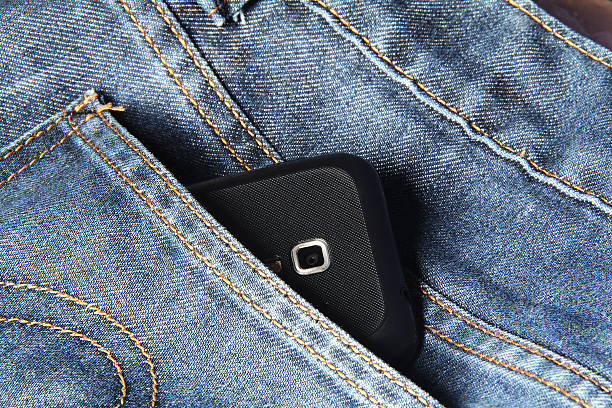 istock Mobile phone in blue jeans pocket. 502376859