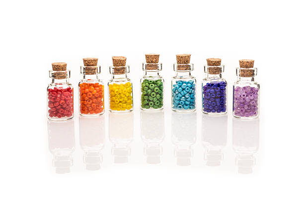 istock Rainbow flag of beads in tiny glass bottles 502378509