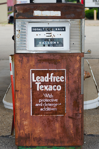 Rolla, United States - June 8, 2014: An old Texaco gas pump sits rotting on Route 66, a rusty relic along the iconic roadway in Rolla, Missouri.