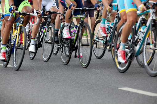 London, United Kingdom - July 7, 2014: Road racing bikes in the Tour de France peloton. The race was first organised in 1903 and is held over 23 days.