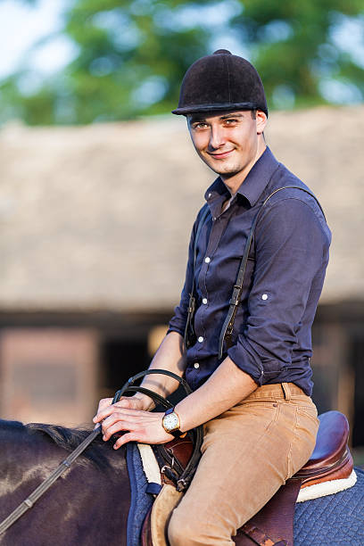 istock Young jockey man riding horse 502382437