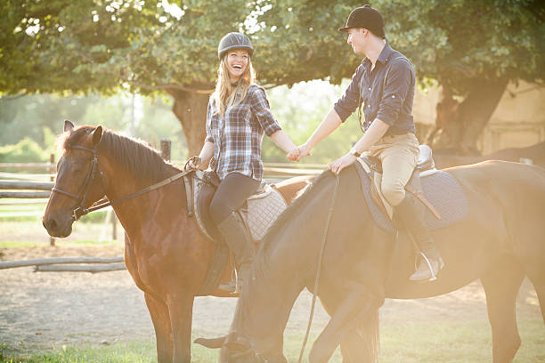 istock Young Couple having a good time riding a horses 502382453