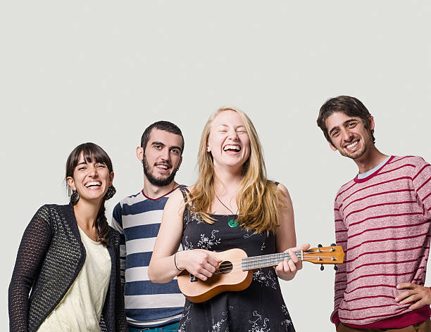 istock Woman playing ukulele for friends on studio 502383686