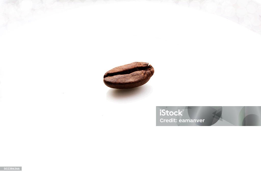 Single coffee bean Single coffee bean, isolated on white 2015 Stock Photo
