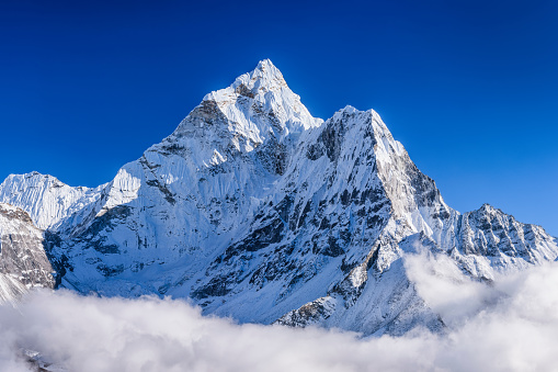 [b] 52MPix XXXXL size panorama of Mount Ama Dablam - probably the most beautiful peak in Himalayas. \n This panoramic landscape is an very high resolution multi-frame composite and is suitable for large scale printing [/b]\nAma Dablam is a mountain in the Himalaya range of eastern Nepal. The main peak is 6,812  metres, the lower western peak is 5,563 metres. Ama Dablam means  \