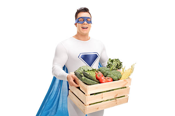 istock Superhero carrying a crate with vegetables 502389070