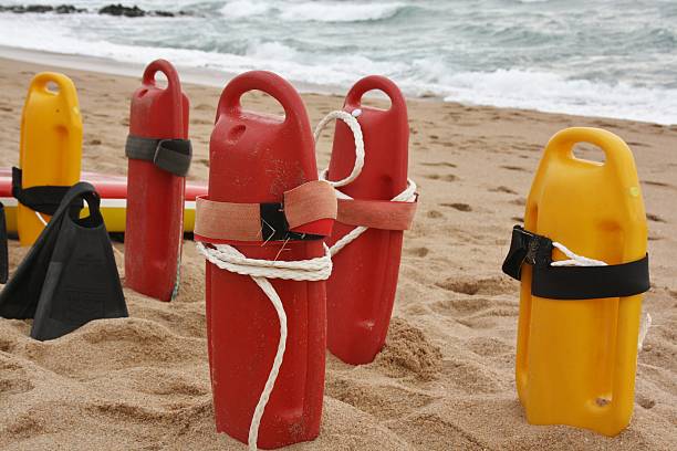 istock Life buoys on beach with flippers 502390360