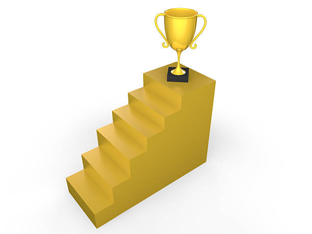 istock 3d trophy on gold stairs 502393518