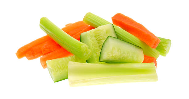 Carrots celery and cucumbers on a white background