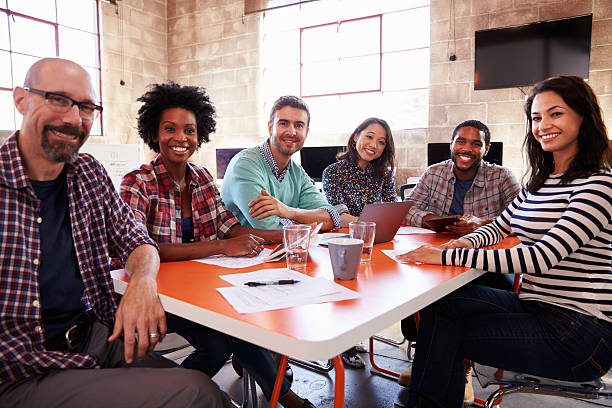 istock Group Of Designers Having Meeting Around Table In Office 502394592