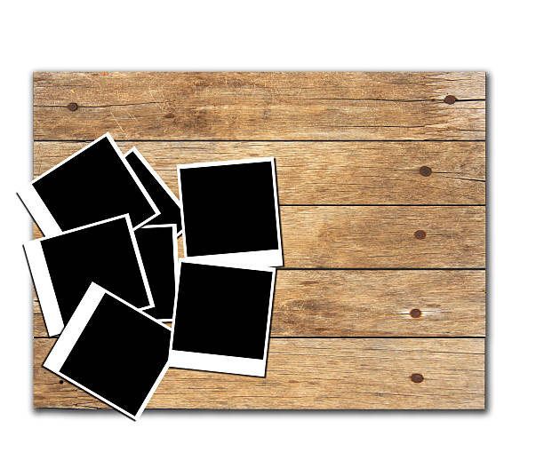 istock Stock Photo:Polaroid photo frames on old wooden background 502396672