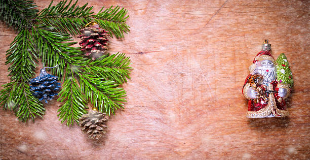 istock Christmas tree twig and Green Santa Claus 502397988