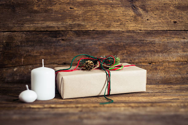 istock Christmas presents on a wooden background with candy cane 502411206
