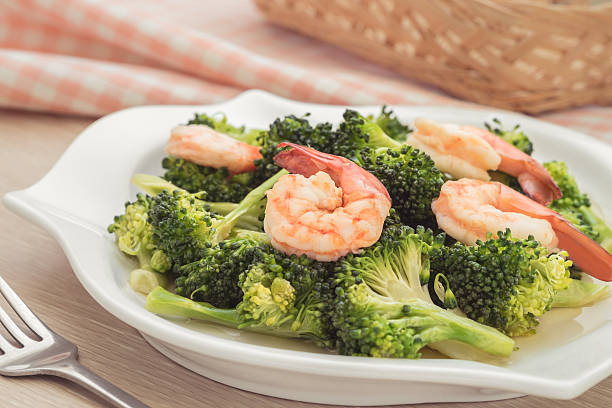 istock Stir fried broccoli with shrimp on plate 502413072